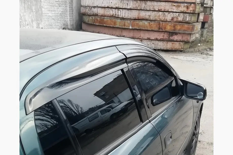 Вітровики, дефлектори вікон Opel Astra G сед/хетч 1998-2009 (скотч) Sunplex