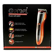 Акумуляторна машинка для стрижки волосся GEMEI GM-6027 Помаранчева Машинка для стрижки з насадками, фото 7