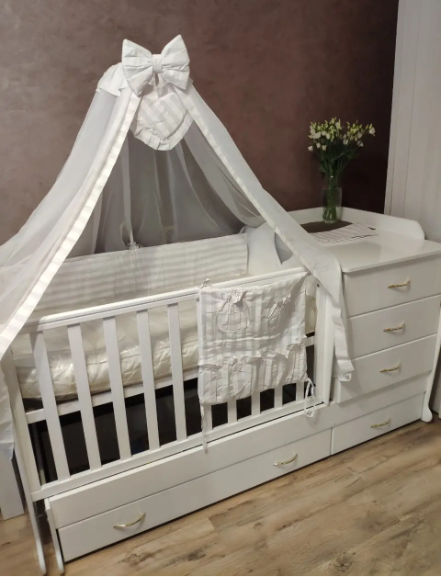 Дитяче ліжечко-трансформер з комодом, ящиками і маятником 3 в 1 Дитяче ліжечко-трансформер з комодом, ящиками і маятником 3 в 1