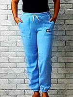 Спортивные женские штаны оптом на флисе с карманами низ на резинке цвет голубой / синий р.46 48 52 54