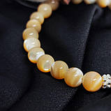 Браслет з перламутру на 24 намистини і вставкою Ніка, фото 3