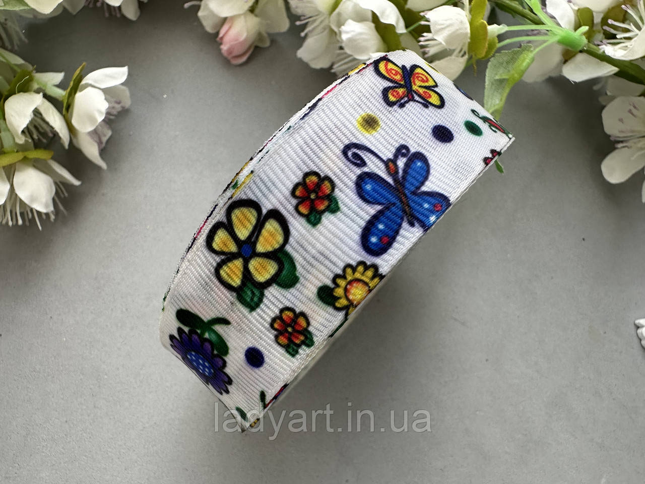 Стрічка репсова з малюнком 2,5 см "Квіти та метелики"