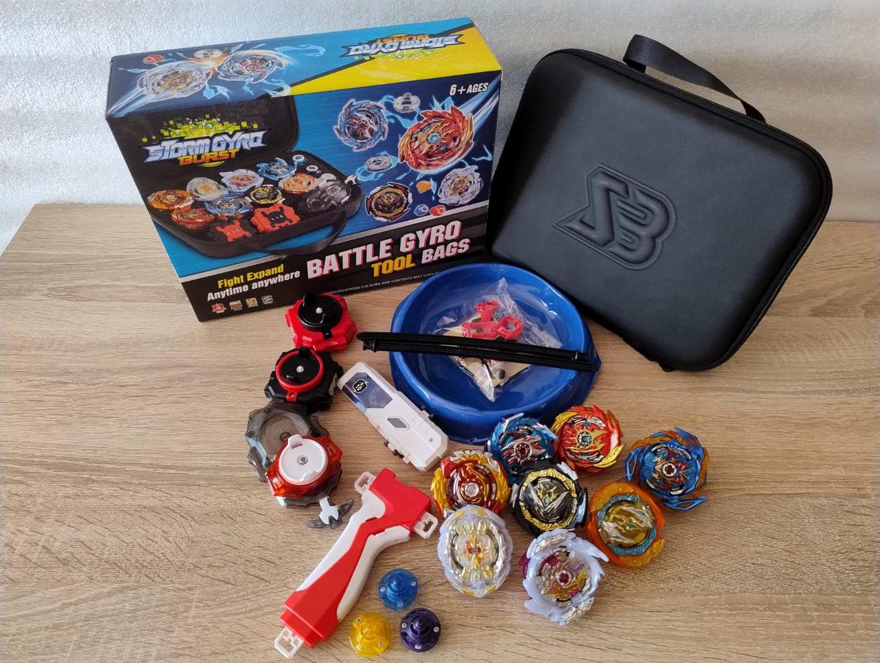 Ігровий набір Бейблейд з 8 дзиги Beyblade, 2 пускових пристроїв, арени, валізи та налыпки