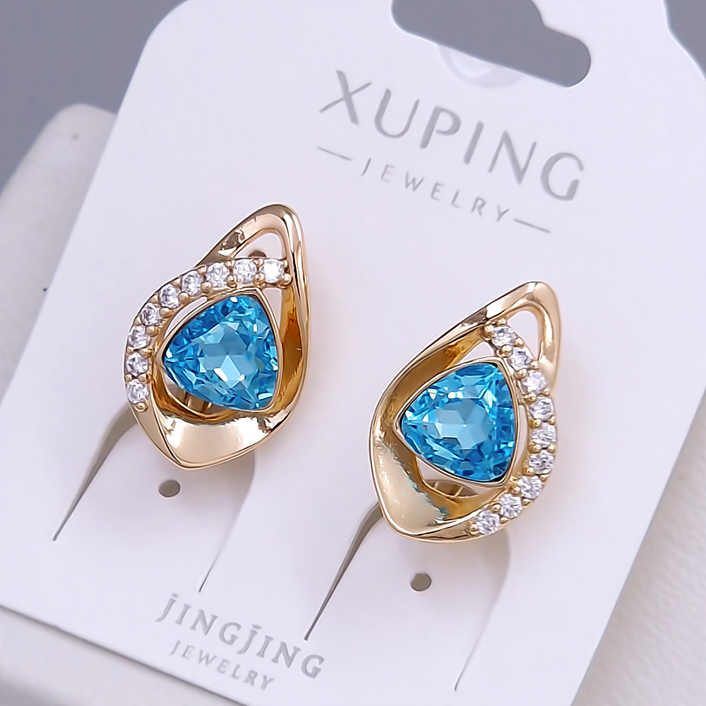 Сережки XР. Позолота 18К. Камені: Swarovski блакитного кольору та циркон. Довжина: 17 мм. Ширина: 11 мм.