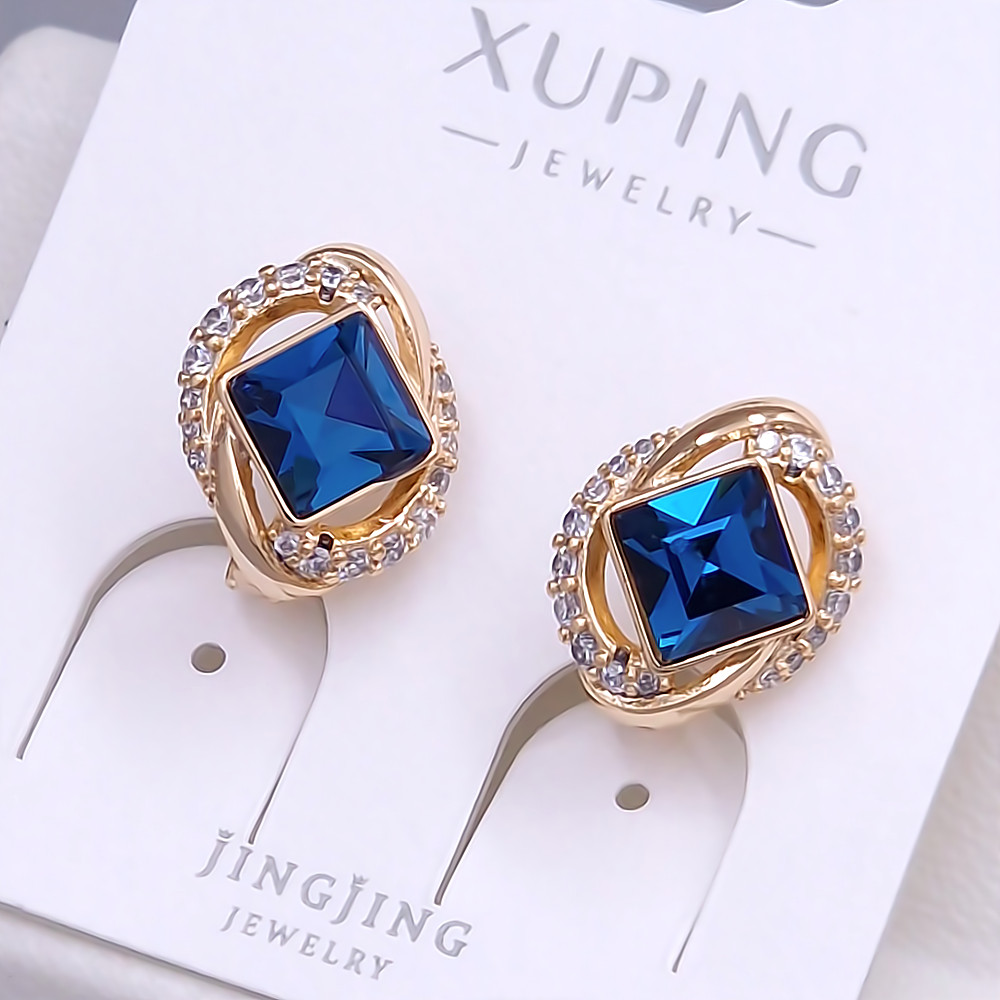 Сережки XР. Позолота 18К. Камені: Swarovski синього кольору та циркон. Довжина: 16 мм. Ширина: 11 мм