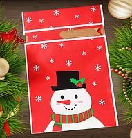 Пакет подарунковий червоний Новорічний Сніговик Капелюх з малюнком і стрічкою затяжкою поліетиленовий 23х15х3 см поштучно