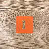 Помаранчева нумерація на шафу з трафаретним шрифтом | Лист