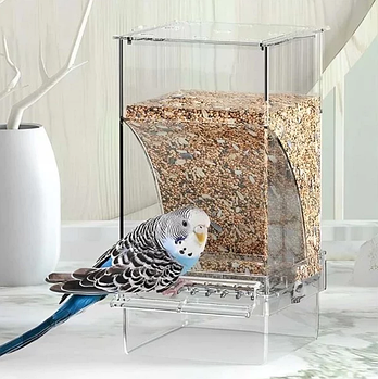 Автоматична годівниця для папуги кріпиться за допомогою гвинтового затискача