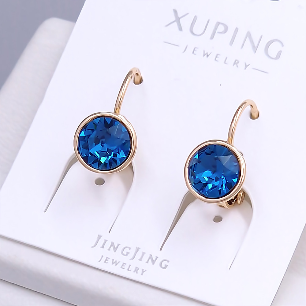 Сережки XР. Позолота 18К. Камені: Swarovski синього кольору. Довжина: 15 мм. Ширина: 9 мм.