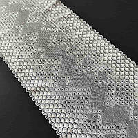 Стрейчеве (еластичне) мереживо білого кольору ("теплий" відтінок) шириною 23 см.