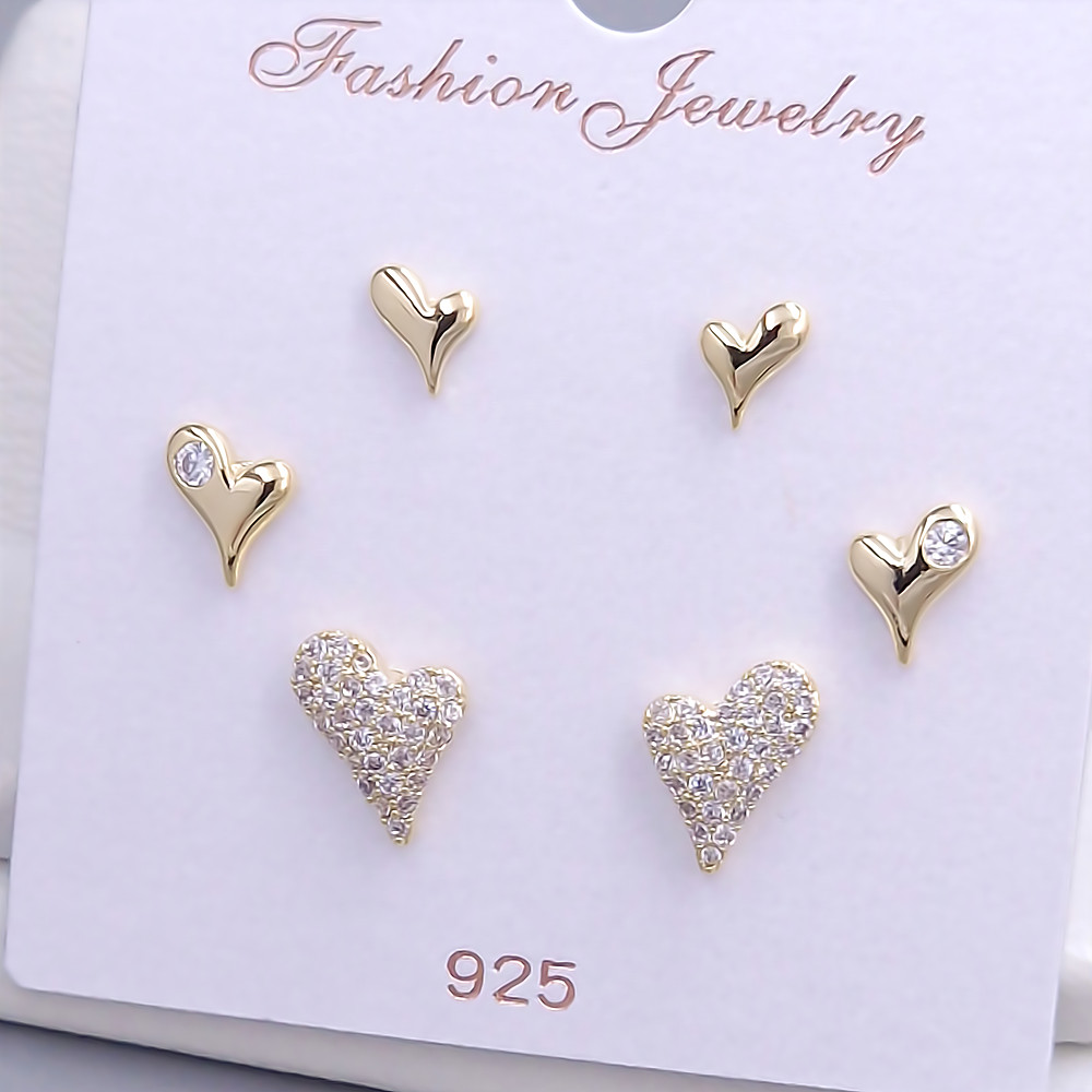 Набір із 3-х пар сережок-гвоздиків FJ. Позолота лимонного відтінку. Камені: циркон