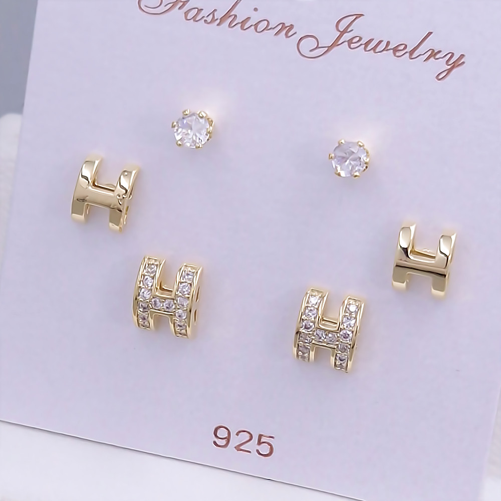 Набір із 3-х пар сережок-гвоздиків FJ. Позолота лимонного відтінку. Камені: циркон