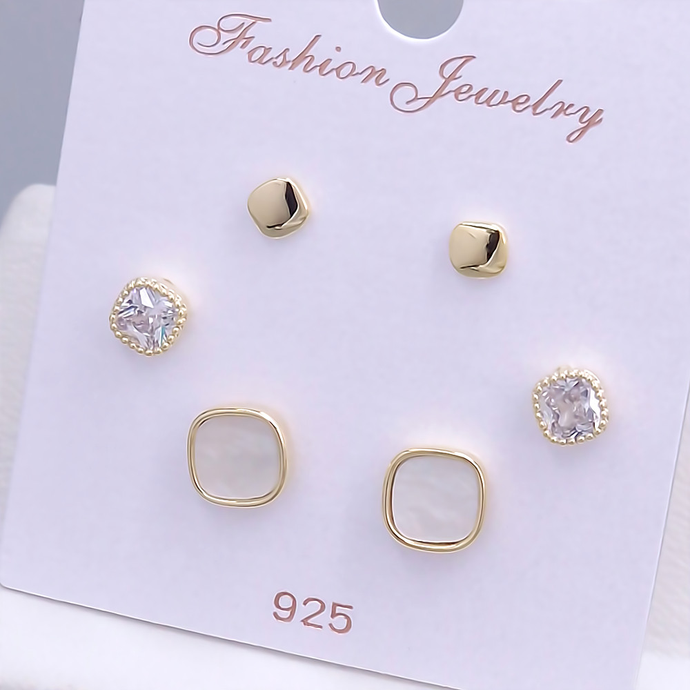 Набір із 3-х пар сережок-гвоздиків FJ. Позолота лимонного відтінку. Камені: циркон