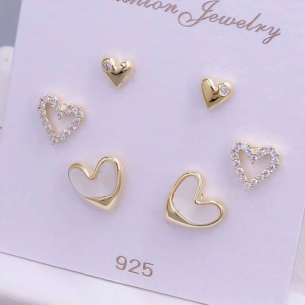 Набір із 3-х пар сережок-гвоздиків FJ. Позолота лимонного відтінку. Камені: циркон