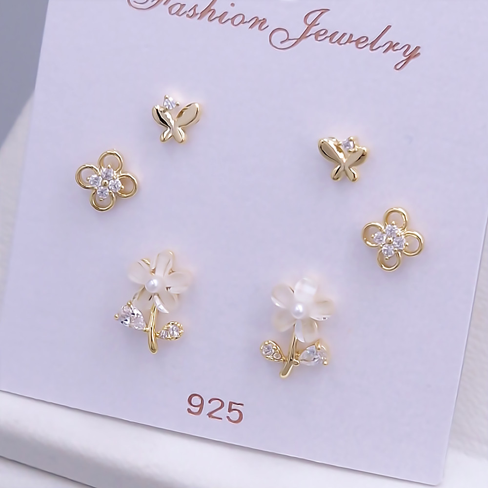 Набір із 3-х пар сережок-гвоздиків FJ. Позолота лимонного відтінку. Камені: циркон