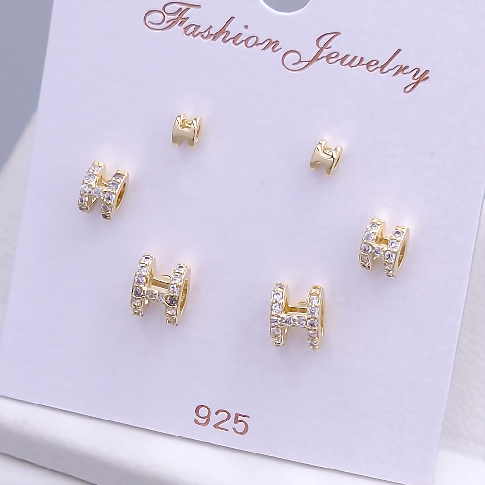 Набір із 3-х пар сережок-гвоздиків FJ. Позолота лимонного відтінку. Камені: циркон