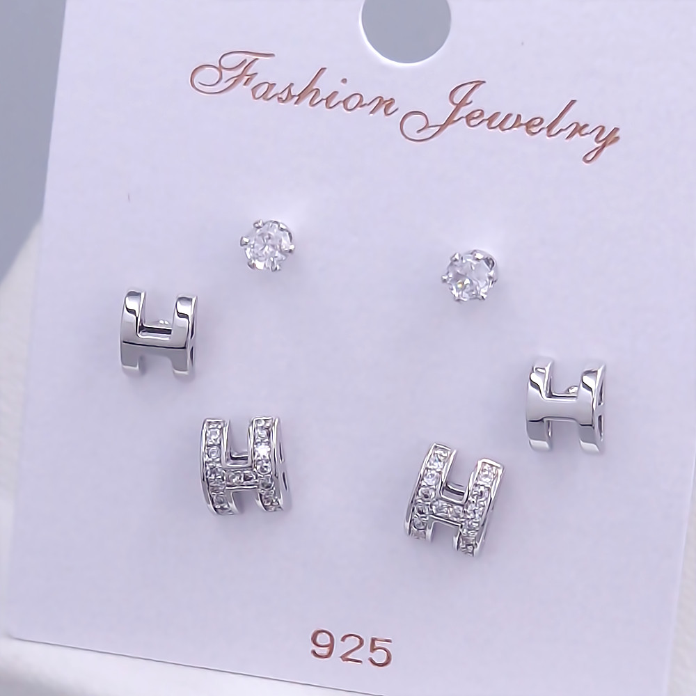 Набір із 3-х пар сережок-гвоздиків FJ. Родій. Камені: білий циркон