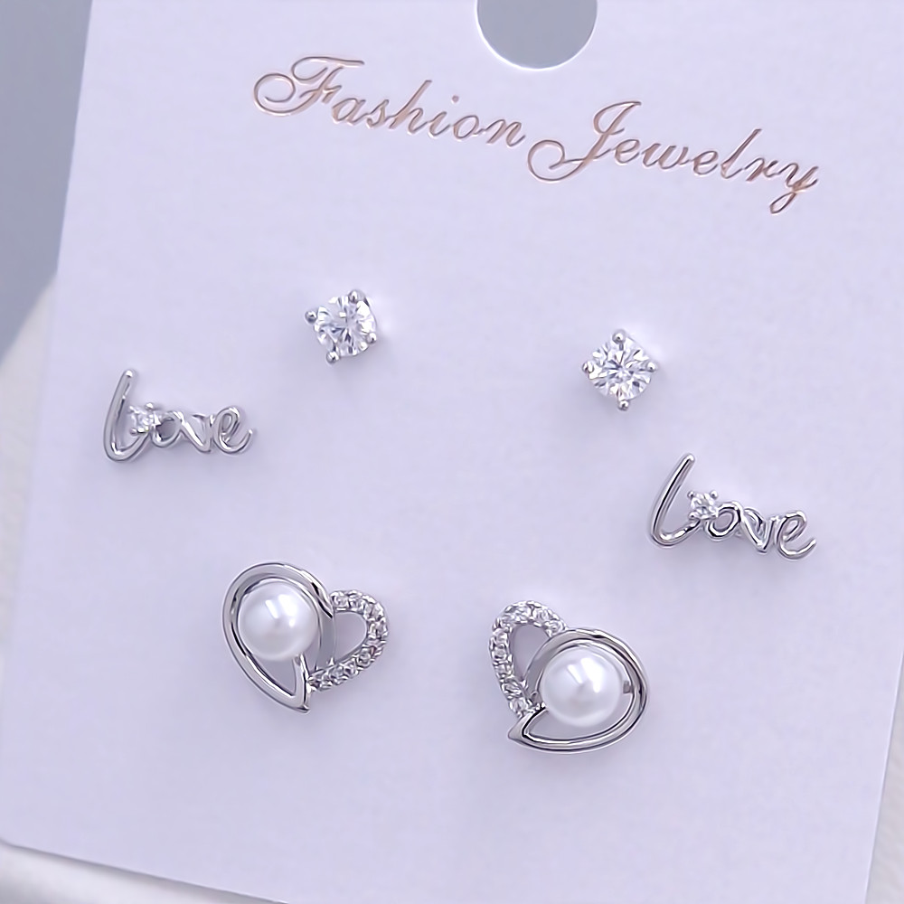 Набір із 3-х пар сережок-гвоздиків FJ. Родій. Камені: білий циркон і перли