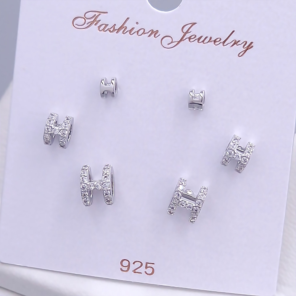 Набір із 3-х пар сережок-гвоздиків FJ. Родій. Камені: білий циркон