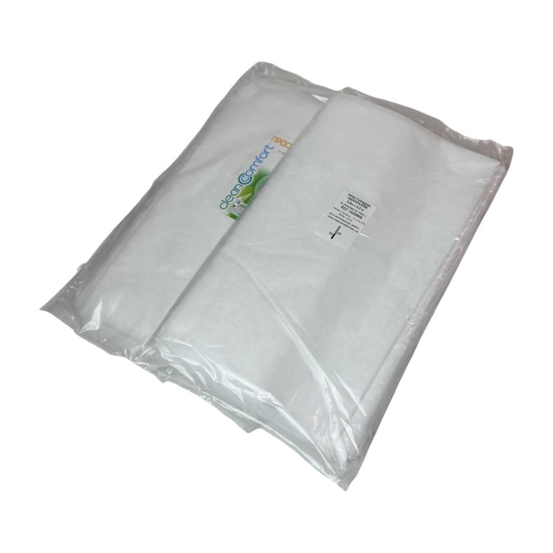 Одноразові простирадла нарізані спанбонд CleanComfort 0,6*2 п.м. 10 шт/уп. в упаковці щільність 15 г/м2
