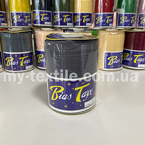 Коса бейка котон 1,5 см бабина 100 ярдів (~93 м) Темно-сірий