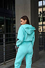 Жіночий зимовий комбінезон бірюзовий утеплений на флісі з капюшоном, фото 3