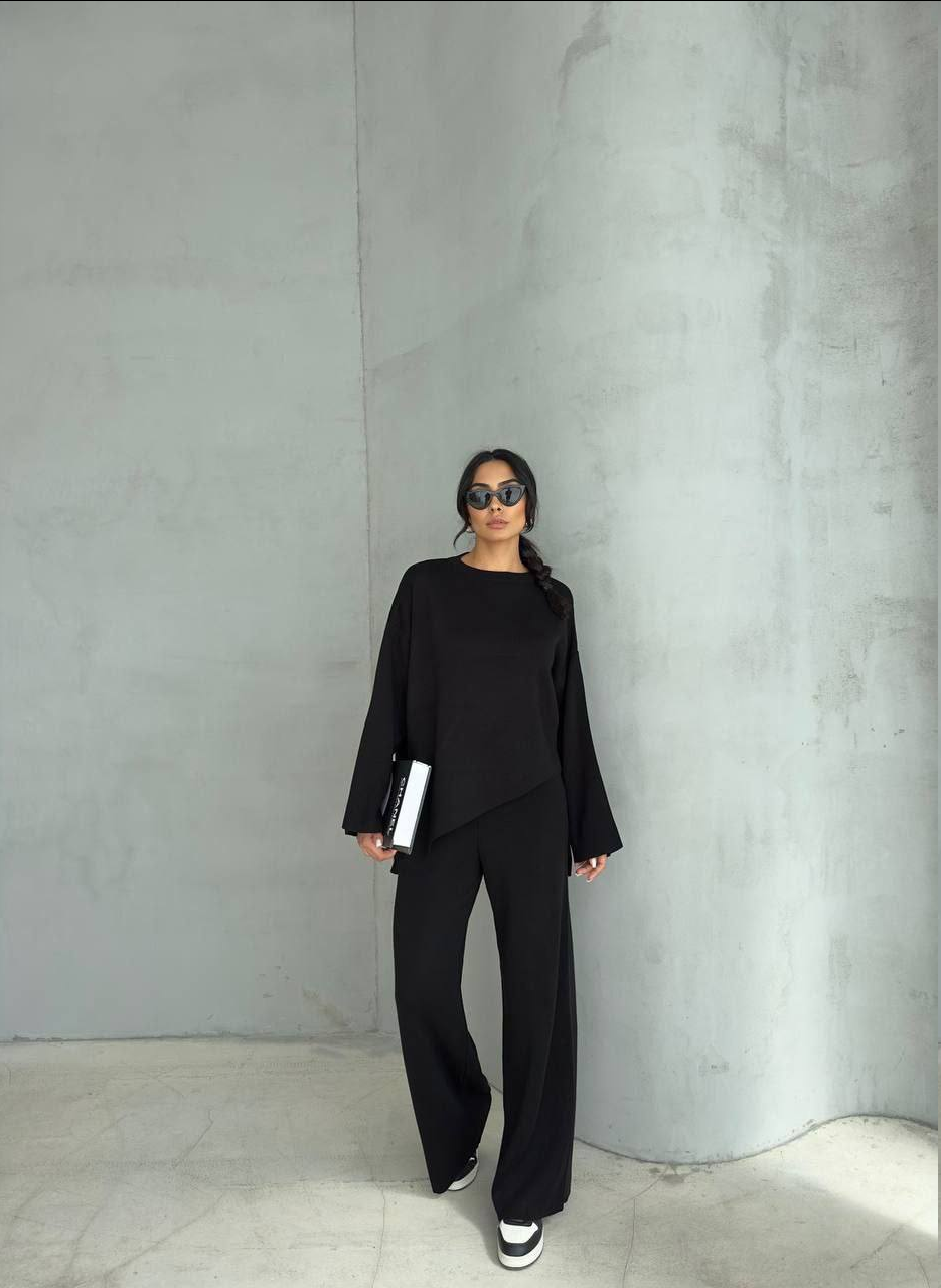 Стильний жіночий костюм із широкими брюками., фото 1