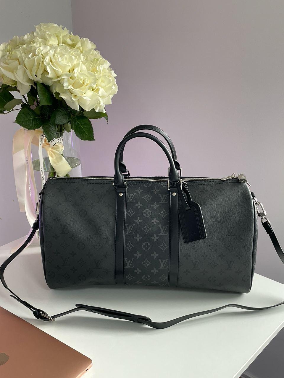 Универсальная шкіряна дорожня сумка Louis Vuitton чорного кольору