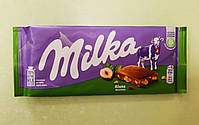 Шоколад Milka з подрібненим фундуком молочний 100 г, фото 4