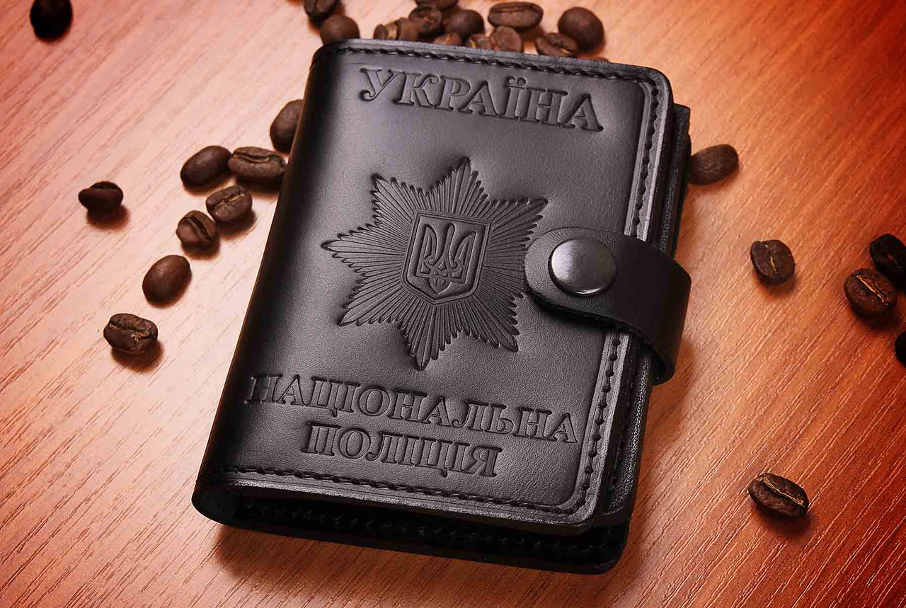 Обкладинка НПУ на кнопці