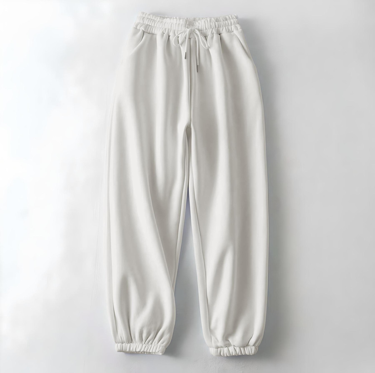 Жіночі зимові спортивні штани білі на флісі на резинці, фото 1