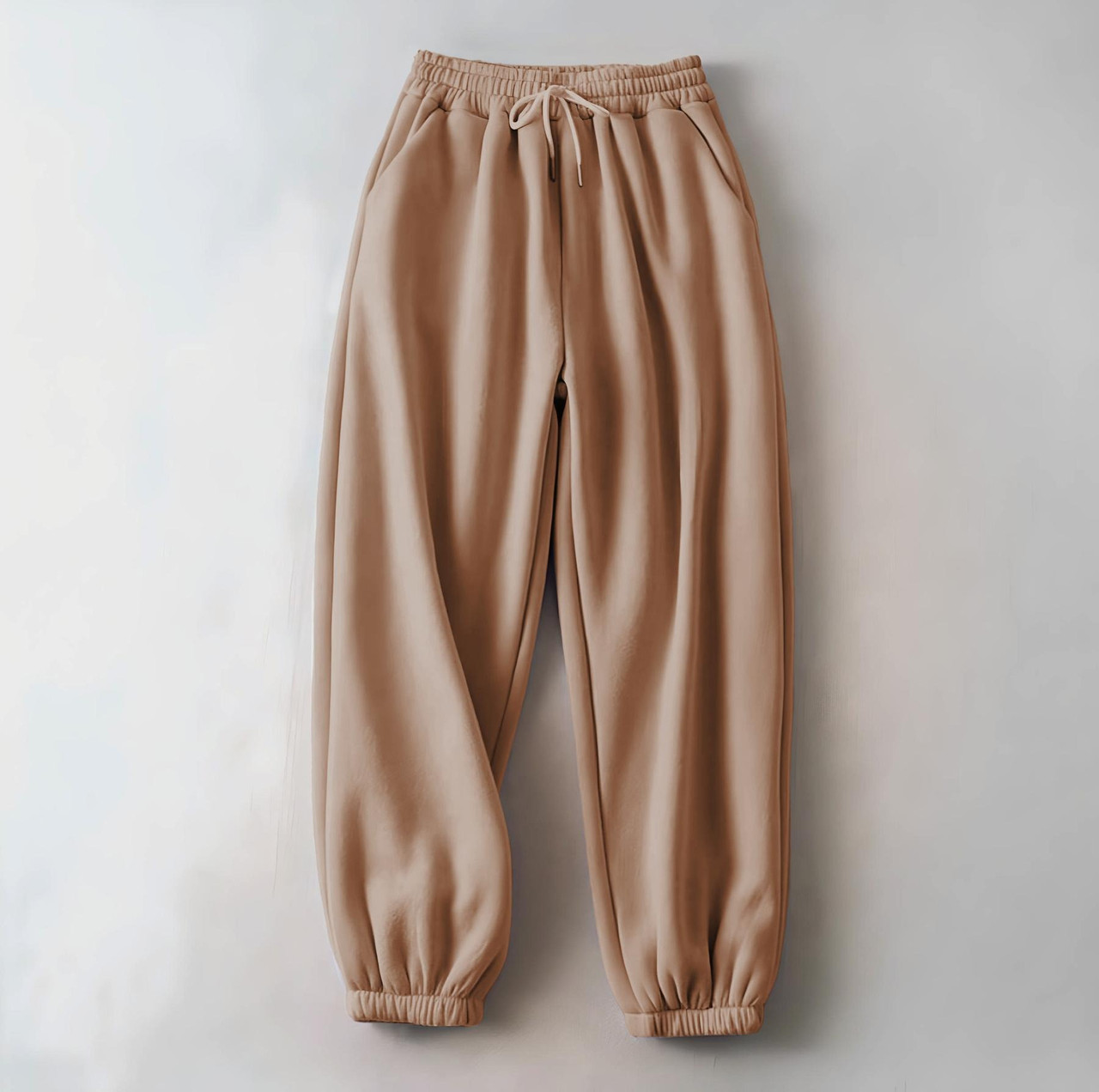 Жіночі зимові спортивні штани бежеві на флісі на резинці, фото 1