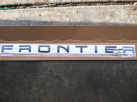 Nissan Frontier 2001-2004 Емблема значок напис на багажник Нова Оригінал