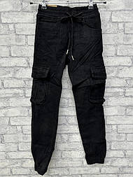 Підліткові чорні джинси на хлопчика з манжетом завужені донизу