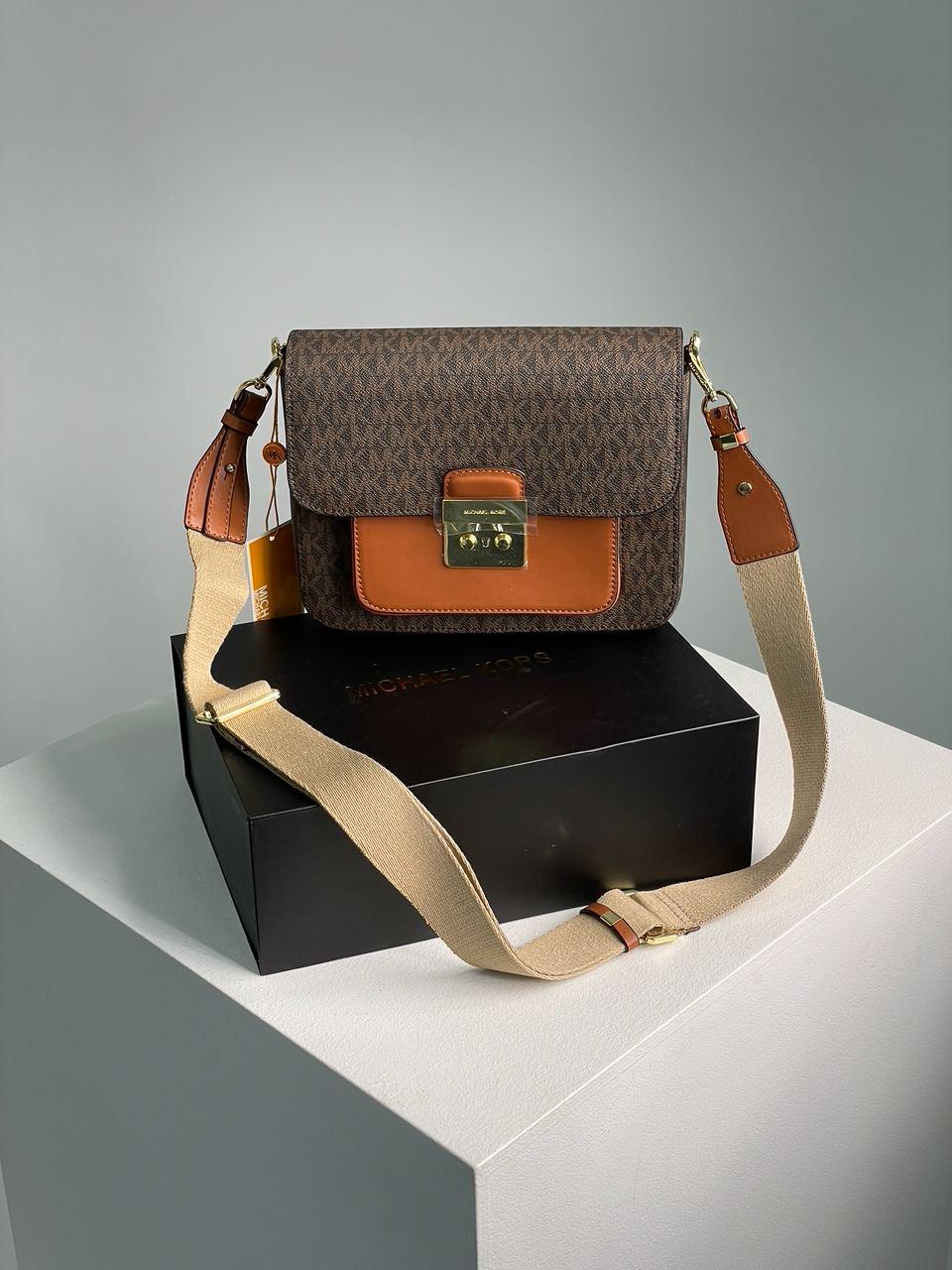Шкіряна жіноча сумочка Michael Kors Sloan Editor Medium Bag коричнева