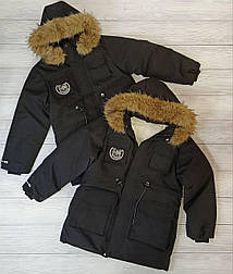Подовжена зимова чорна куртка парка для хлопчика в розмірі 130