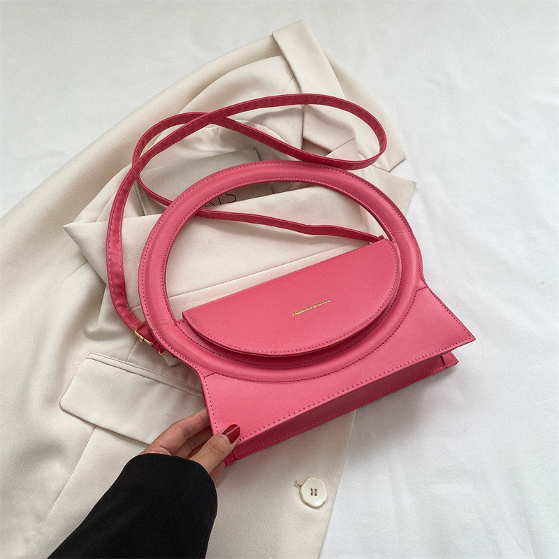 Жіноча сумка з круглою ручкою 1015 крос-боді рожева на ремінці, фото 1