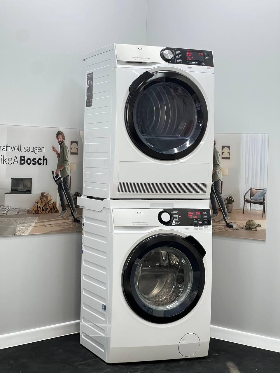 Комплект сушильна та пральна машина бренду AEG з перехідною планкою, фото 1