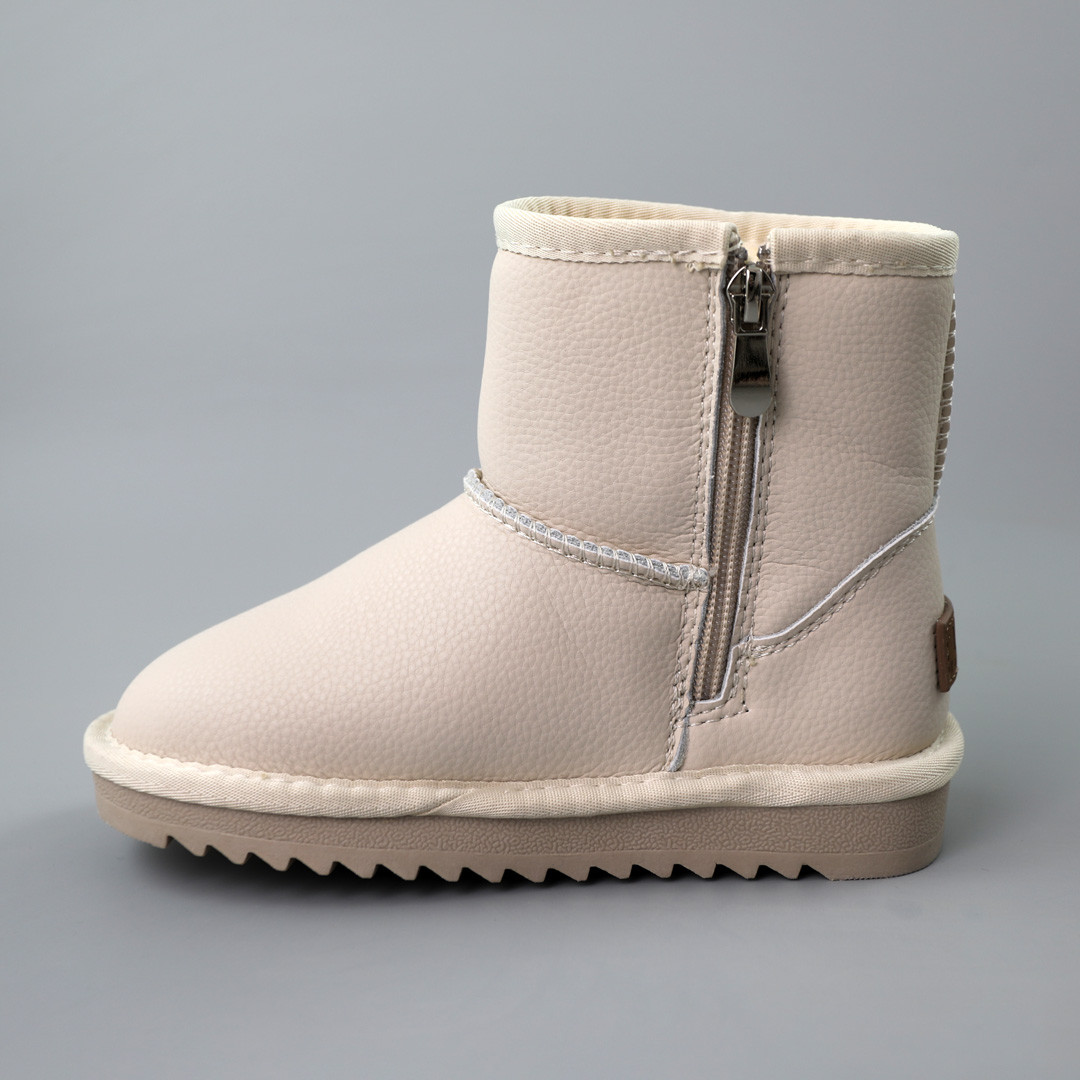 Зимові дитячі зимові уггі для дівчинки з натуральної шкіри збоку на блискавці