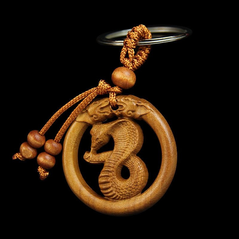 Витончений дерев'яний брелок у формі знаків зодіаку за китайським календарем ЗМІЇ символ 2025 року