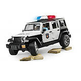 Автомодель Bruder Поліцейський автомобіль Wrangler Unlimited Rubicon зі світлом, звуком і фігуркою поліцейського, фото 3