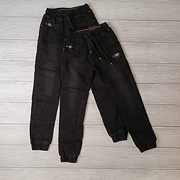 Чорні утеплені флісом джинси на хлопчика в розмірі 164