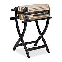 Чорна підставка для валізи з захистом стіни