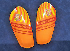Щитки футбольні клубні помаранчеві 17 см Mercurial 1008M
