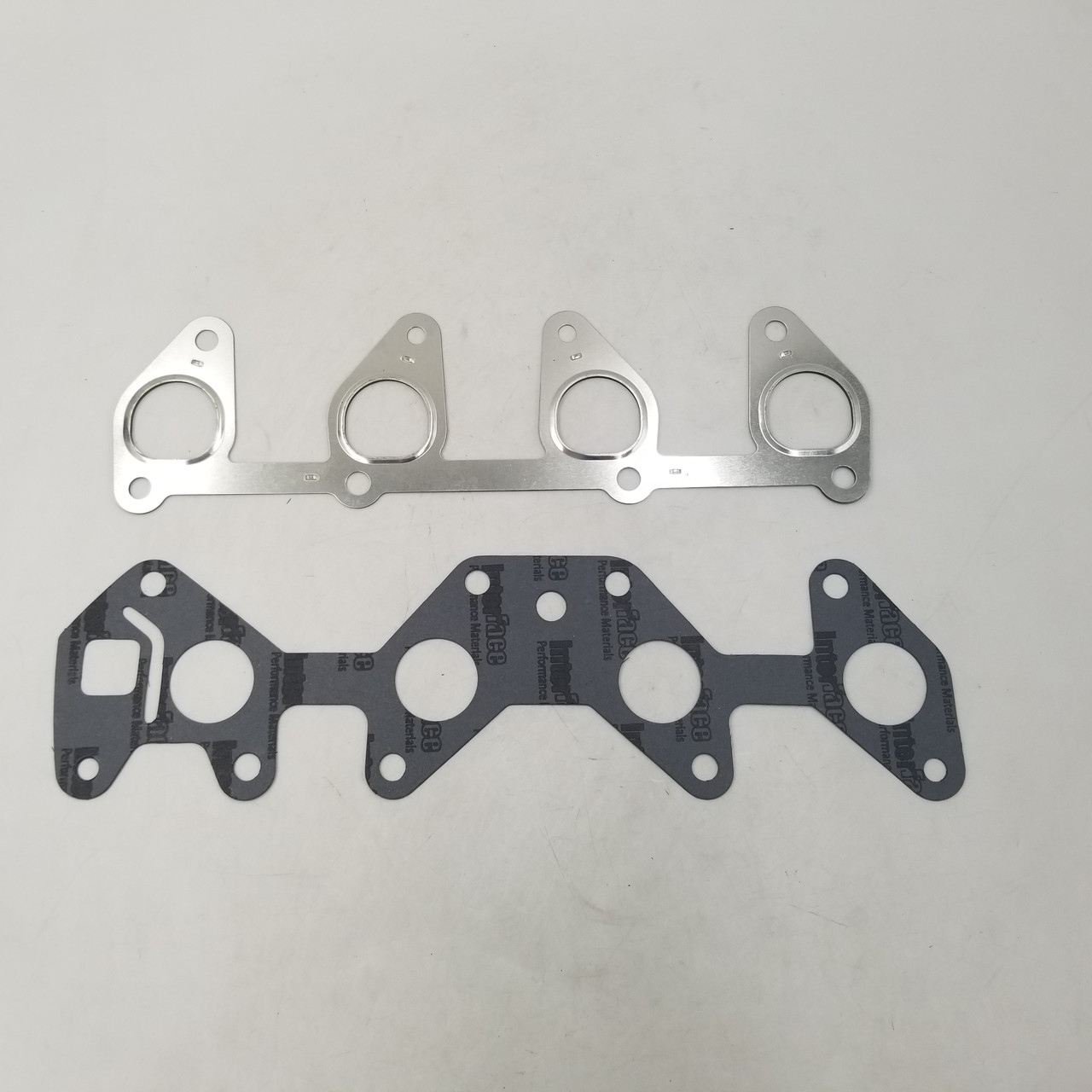 Прокладка колектора Ланос 1,5 впуск+випуск (комплект 2 прокладки) SHIN KUM Корея 96143564, 96181207