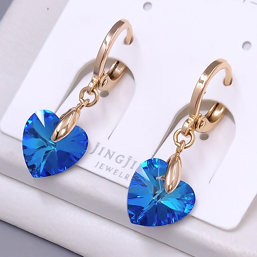 Сережки XР. Позолота 18К. Камені: Swarovski. Довжина: 26 мм. Ширина: 10 мм.