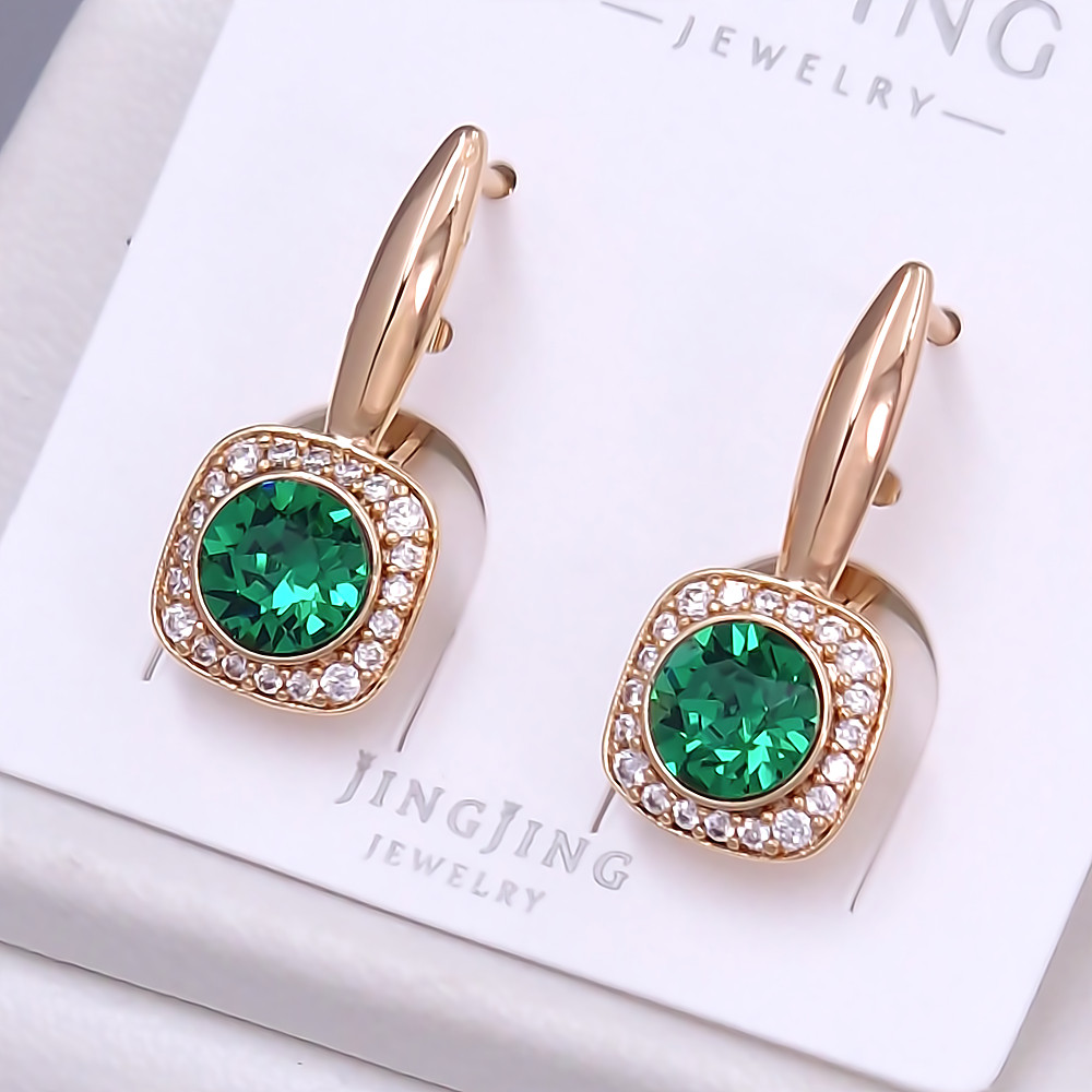 Сережки XР. Позолота 18К. Камені: Swarovski зеленого кольору та циркон. Довжина: 24 мм. Ширина: 9 мм.