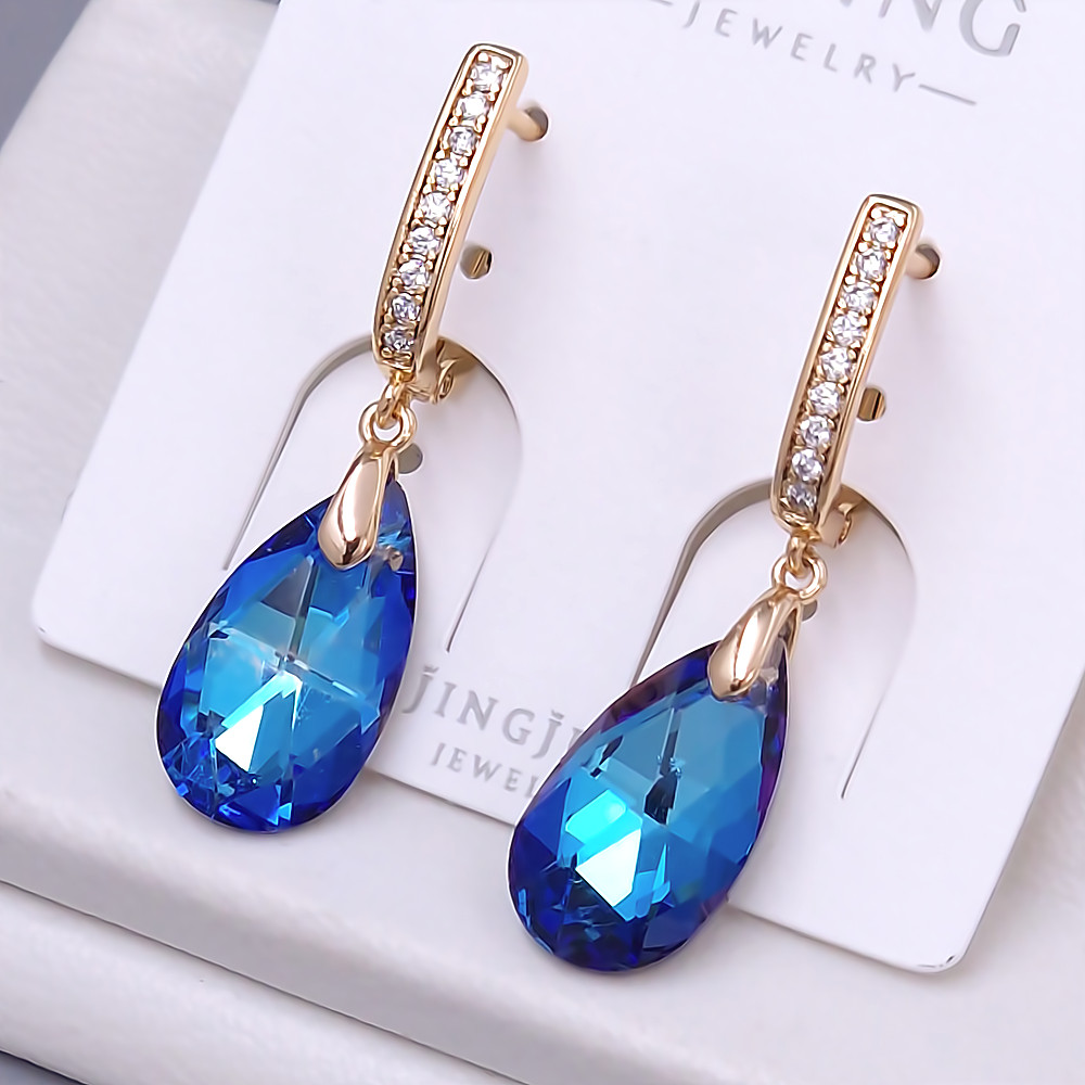 Сережки XР. Позолота 18К. Камені: Swarovski та циркон. Довжина: 35 мм. Ширина: 9 мм.