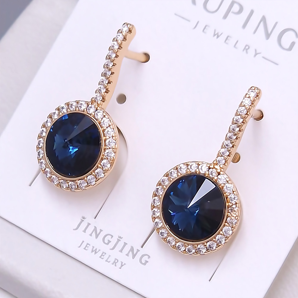 Сережки XР. Позолота 18К. Камені: Swarovski та циркон. Довжина: 23 мм. Ширина: 12 мм.