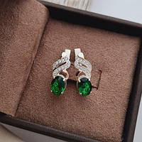 Срібні сережки із золотими напайками овальними зеленими та білими цирконами